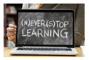 A screen which states never stop learning. It is a laptop.